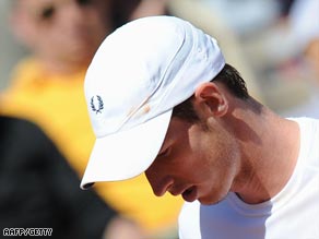 Murray bows his head as he faces up to defeat by world number 58 Monaco.