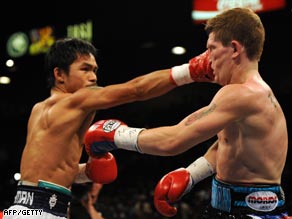 Pacquiao lands a solid right to Hatton on his way to a comprehensive victory.