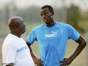Glen Mills (left) has guided Bolt to the very top of world athletics.