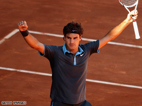 Roger Federer celebrates after beating Rafael Nadal in the Madrid Open final