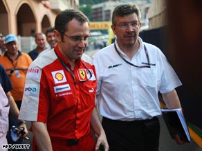 Ferrari's team manager Luca Baldisseri (L) and Brawn GP's team principal Ross Brawn leave the meeting in Monaco.