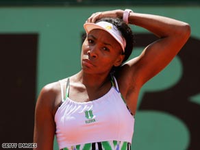 A dejected Venus faces up to defeat to Szavay in the third round of the French Open.