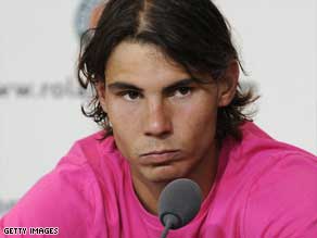 Rafael Nadal faces media after his shock loss to Sweden's Robin Soderling at the French Open on Sunday