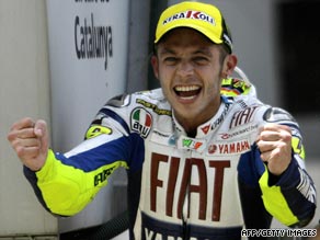 Rossi shows his delight after clinching a thrilling victory over Jorge Lorenzo in Barcelona on Sunday.