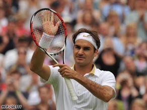 Federer acknowledges the crowd after his opening day Centre Court victory.