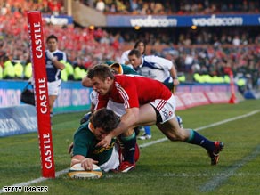 South Africa's Jaque Fourie lunges over the line to score a vital try in his side's series-clinching victory.