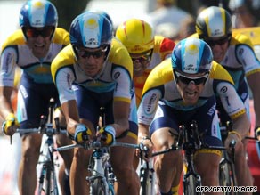 Armstrong (far right) powers his Astana team over the line to take the Tour de France team time-trial.