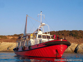 The old tug-boat, Le Mangier, has been converted into a eco-friendly vessel with three sails and solar panels.