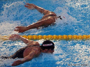 Michael Phelps, below, was neck and neck with Serbian rival Milorad Cavic in the closing stages of the race.