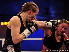 Germany's Ina Menzer, left, fights American Franchesca Alcanter during a WIBF and WBC featherweight bout in May.