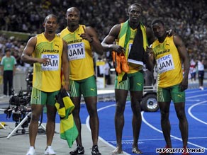 Bolt (second right) celebrates his third gold medal after helping Jamaica to victory in the 4x100m relay.