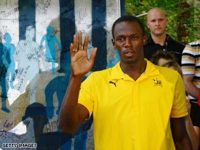 Bolt received a commemorative slab of the Berlin Wall as he celebrated his world championship success.