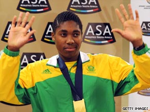 Semenya shows off her gold medal after returning to South Africa as the world 800m champion.