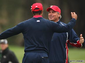 U.S. captain Fred Couples congratulates Woods after his decisive victory.