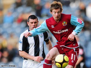 Winger Wade Elliott opened the scoring as Burnley reached the FA Cup fifth round with a win over WBA.