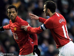 Nani (left) celebrates with Ryan Giggs after scoring the opening goal against Derby on Sunday.