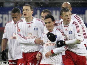 Hamburg celebrate Piotr Trochowski's opening goal in their 2-0 victory over Arminia Bielefeld.