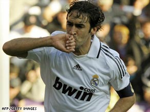 Raul celebrates in familiar style after breaking Di Stefano's Real Madrid record against Sporting Gijon.