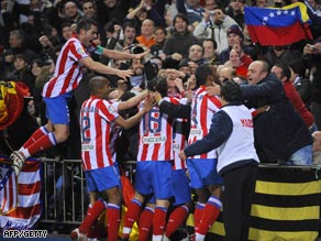 Atletico players celebrate Aguero's winning goal in the Vicente Calderon stadium.