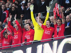 Rio Ferdinand (far right) lifts the trophy at Wembley after the penalty shootout win.