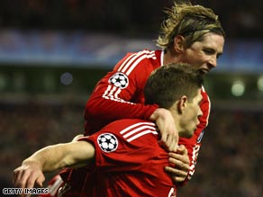 Torres, top, and Gerrard did the damage as Liverpool destroyed their rivals to reach the last eight in Europe.