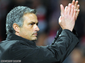 Jose Mourinho applauds supporters at Old Trafford following his team's defeat against Manchester Utd.