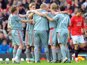 Liverpool celebrate Fabio Aurelio's superb free-kick as they crushed Manchester United 4-1 at Old Trafford.