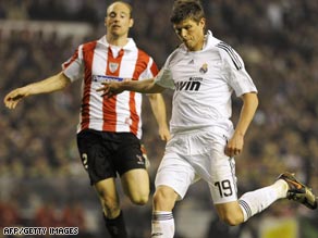 Klass-Jan Huntelaar (right) scored twice as Real Madrid hit five in an action-packed match against Bilbao.