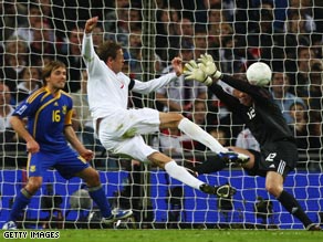 Crouch fires England into the lead at Wembley on his first start under coach Capello.