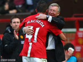 Macheda receives a hug from manager Sir Alex Ferguson after scoring Manchester United's last-gasp winner.