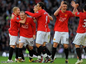 United's players celebrate a Rooney goal during the second half revival at Old Trafford.