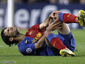 Marquez goes down clutching his knee in the Camp Nou clash with Chelsea.