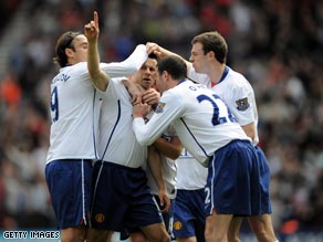 Ryan Giggs points the way to victory after scoring the opener at the Riverside.