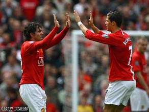 United goalscorers Tevez and Ronaldo celebrate the second goal at Old Trafford.