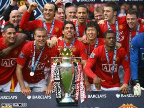 United players celebrate after securing the draw against Arsenal that sealed the championship.