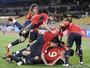 Fernando Torres (No. 9) is congratulated after his opening goal in the 5-0 rout of New Zealand.