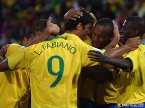 Brazil players celebrate after Maicon's third goal in their comfortable victory over the United States.