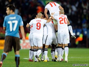 Egypt players celebrate Mohamed Homos' goal in their stunning 1-0 victory over world champions Italy.