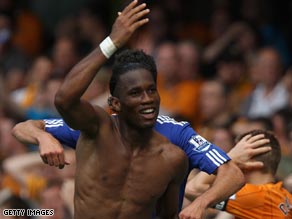 Drogba celebrates his dramatic late winner for Chelsea at Stamford Bridge.