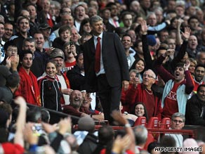 Arsene Wenger has to stand with Manchester United fans after being sent off at Old Trafford.