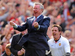 Ferguson and substitute Gary Neville celebrate Owen's late winner.