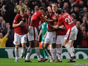 Giggis is congratulated by teammates after scoring his 150th goal for United.