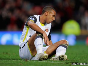 A dejected Anton Ferdinand reflects on his late own goal at Old Trafford.