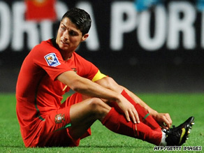 Cristiano Ronaldo holds his ankle before going off in Portugal's win over Hungary.