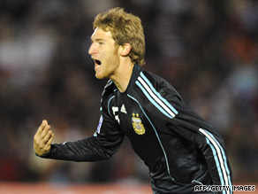 Mario Bolatti rejoices after scoring the decisive goal that sent Argentina into next year's World Cup.