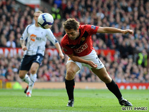 Michael Owen's deflected header put Manchester United on the road to a hard-fought victory.