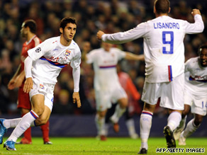 Maxime Gonalons (left) celebrates his equalizing goal as Lyon went on to stun Liverpool 2-1 at Anfield.