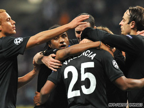 Antonio Valencia is congratulated by team-mates after scoring Manchester United's winner in Moscow.