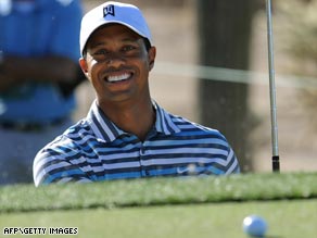 Woods is clearly enjoying himself as he lands a ball on the green from a bunker during his Match Play warm-up.