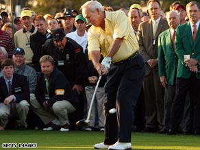Arnold Palmer shows he has not lost any of his old magic as he strikes the first ball in the 73rd Masters.